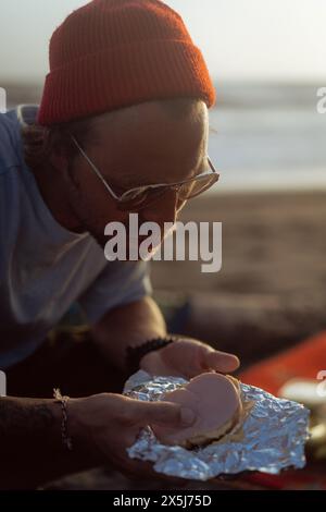 Young man in a red knitted hat. Stock Photo