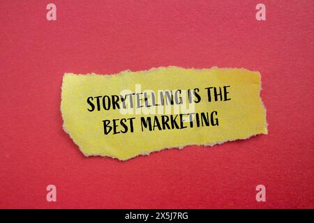 Storytelling is the best marketing  words written on torn yellow paper with red background. Conceptual storytelling is the best marketing symbol. Copy Stock Photo