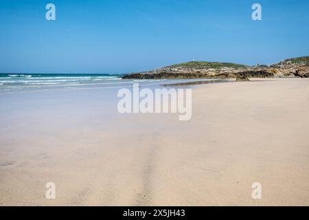 A view over Fistral Beach to Towan Headland on the coast of Newquay in Cornwall in the UK. Stock Photo