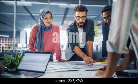 Multi-Ethnic Office Conference Room Businesspeople Meeting Gather Around Table. Diverse Team of Creative Professionals Talk, Brainstorms, work in Innovative Digital e-Commerce Startup. Stock Photo