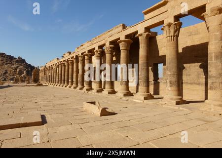 Colonnades Temple of Arsenophis courtyard. Philae Temple complex, Agilkia Island, Aswan Dam reservoir. Burial place of Osiris. Egypt Stock Photo