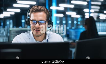Customer Support Operator in Headset Video Calling on Computer at Evening Office. Call Center Agent, Service Support Manager Speaking to Distance Customer in Webcam Chat. Helpline Concept Stock Photo
