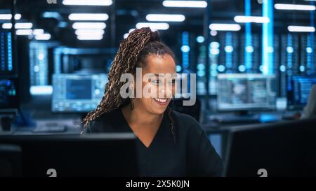 Professional IT Programer Working in Data Center on Desktop Computer with Two Displays, while Doing Development of Software and Hardware. Data Network and IT Technologies Concept Stock Photo