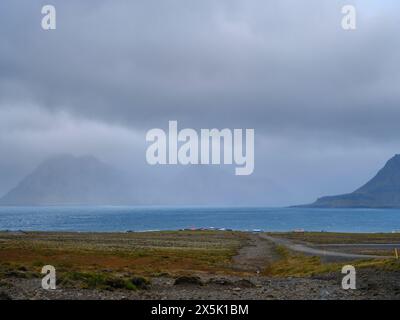 Storm over Reykjarfjordur and village Gjogur. The Strandir in the Westfjords (Vestfirdir) in Iceland during autumn. Stock Photo