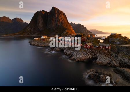 Long exposure to capture the warm light during an autumn sunrise in the fisherman village of Hamnoy, Lofoten Islands, Nordland, Norway, Scandinavia, E Stock Photo