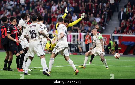 LEVERKUSEN, GERMANY - MAY 09: Gianluca Mancini of Rome scores Leverkusen's first goal via own goal Mile Svilar of AS Roma during the UEFA Europa League 2023/24 Semi-Final second leg match between Bayer 04 Leverkusen and AS Roma at BayArena on May 09, 2024 in Leverkusen, Germany. © diebilderwelt / Alamy Stock Stock Photo