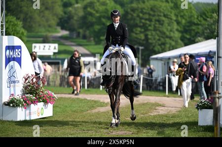 Badminton Estate, Gloucestershire, UK. 10th May, 2024. 2024 MARS Badminton Horse Trials Day 3; Janelle Price (NZL) riding GRAPPANERA enters the dressage ring Credit: Action Plus Sports/Alamy Live News Stock Photo