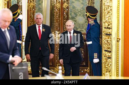 Moscow, Russia. 09th May, 2024. Russian President Vladimir Putin escorts Cuban President Miguel Díaz-Canel, left, to an expanded bilateral meeting at the Grand Kremlin Palace, May 9, 2024 in Moscow, Russia. Credit: Mikhail Metzel/Kremlin Pool/Alamy Live News Stock Photo