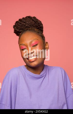 Studio portrait of smiling woman Stock Photo