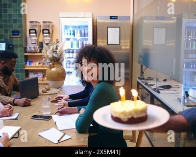 UK, London, Coworkers celebrating birthday in office Stock Photo