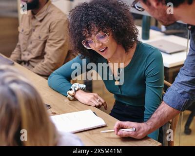 UK, London, Coworkers having meeting in modern office Stock Photo
