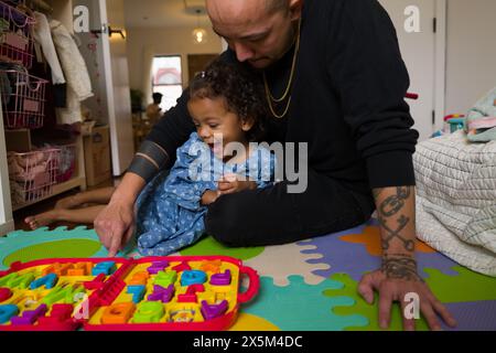 Father playing with daughter Stock Photo