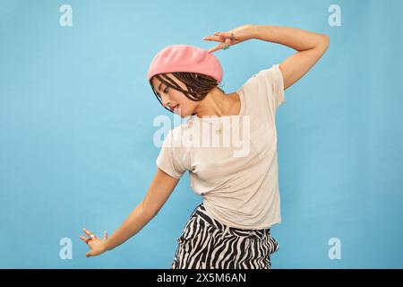 Studio shot of stylish woman in pink beret Stock Photo