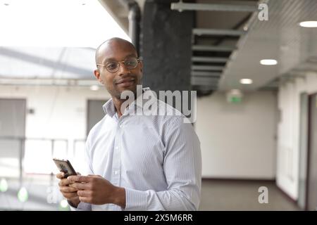 Businessman using smart phone Stock Photo