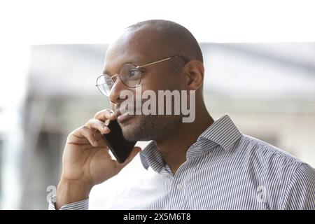 Businessman talking on phone Stock Photo