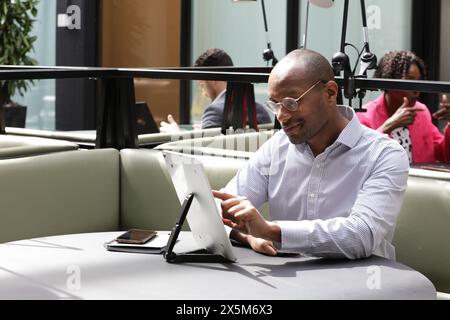 Businessman working on laptop in office Stock Photo