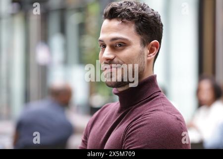 Smiling young businessman in office Stock Photo