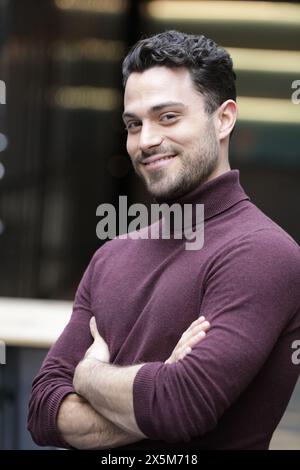 Portrait of smiling businessman in office Stock Photo
