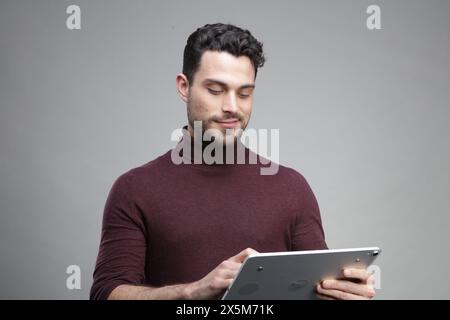 Young businessman using digital tablet Stock Photo