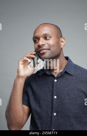 Businessman talking on phone Stock Photo