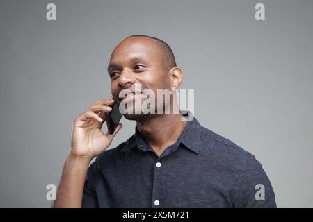 Businessman talking on phone Stock Photo