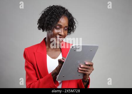 Smiling businesswoman using tablet Stock Photo