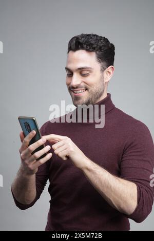 Young man using smart phone Stock Photo