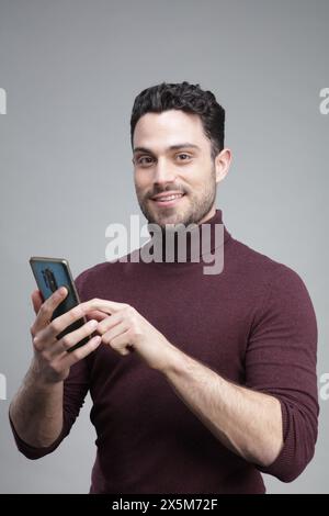 Young man using smart phone Stock Photo