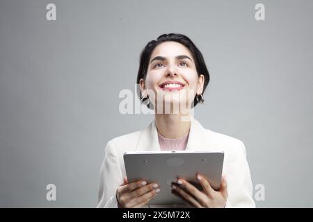 Young businesswoman using tablet Stock Photo