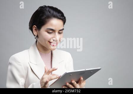 Young businesswoman using tablet Stock Photo