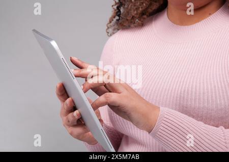 Close-up of female hands using digital tablet Stock Photo