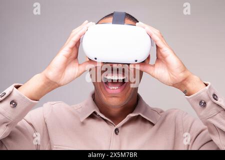 Smiling man in virtual reality headset Stock Photo