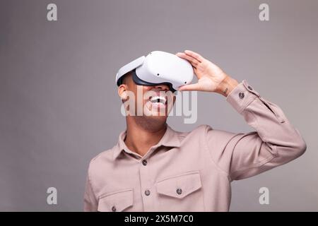 Smiling man in virtual reality headset Stock Photo