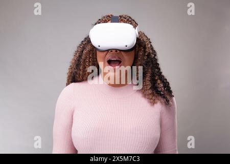 Woman wearing virtual reality headset Stock Photo