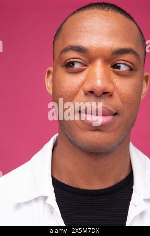 Mid adult man looking away Stock Photo