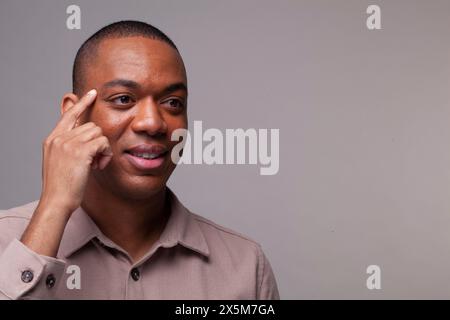 Man making thinking gesture Stock Photo