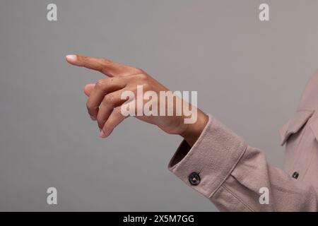 Close-up of male hand making pointing gesture Stock Photo