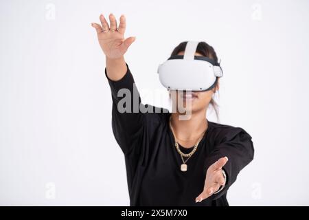 Studio shot of young woman wearing VR headset Stock Photo
