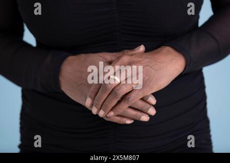 Close up of womans hands with engagement ring Stock Photo