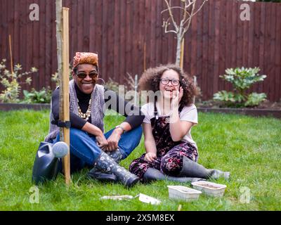 Portrait of mother and daughter in backyard Stock Photo