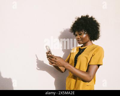 Young woman using smartphone Stock Photo