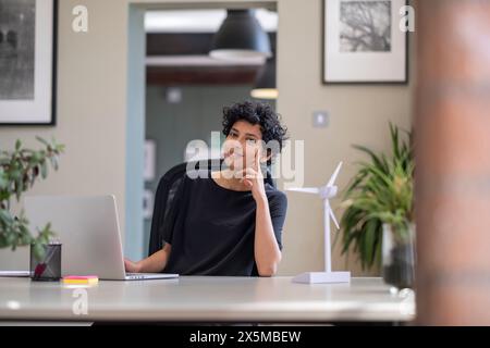 Young engineer working on laptop in office Stock Photo