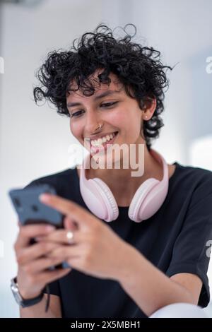 Young woman using smart phone Stock Photo