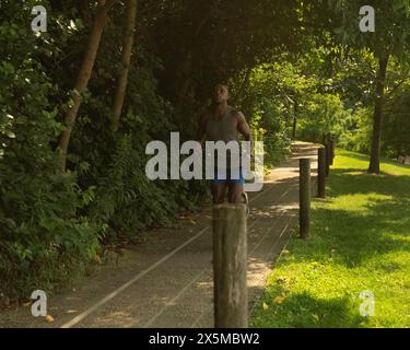 Athletic man jogging in park Stock Photo