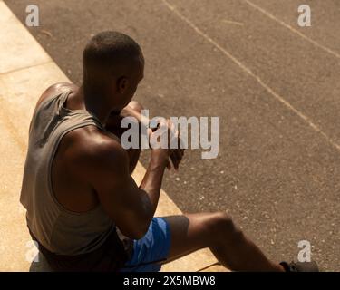 Athletic man looking at smart watch Stock Photo