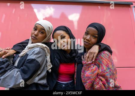 Portrait of smiling young women wearing hijabs Stock Photo