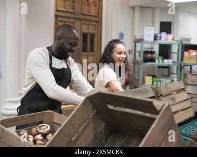 Volunteers working in community food center Stock Photo