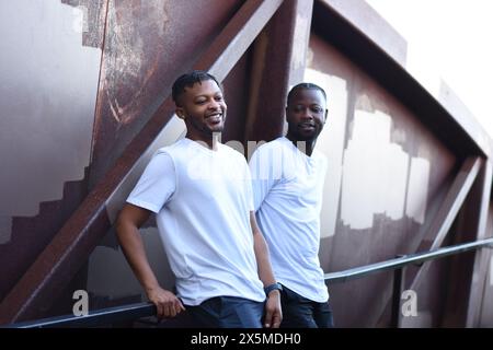 USA, Louisiana, Smiling gay couple on bridge Stock Photo