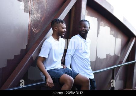 USA, Louisiana, Smiling gay couple on bridge Stock Photo