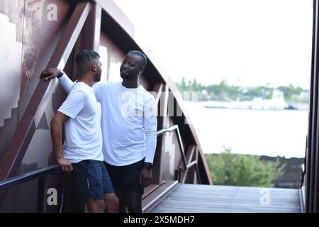 USA, Louisiana, Smiling gay couple on bridge Stock Photo